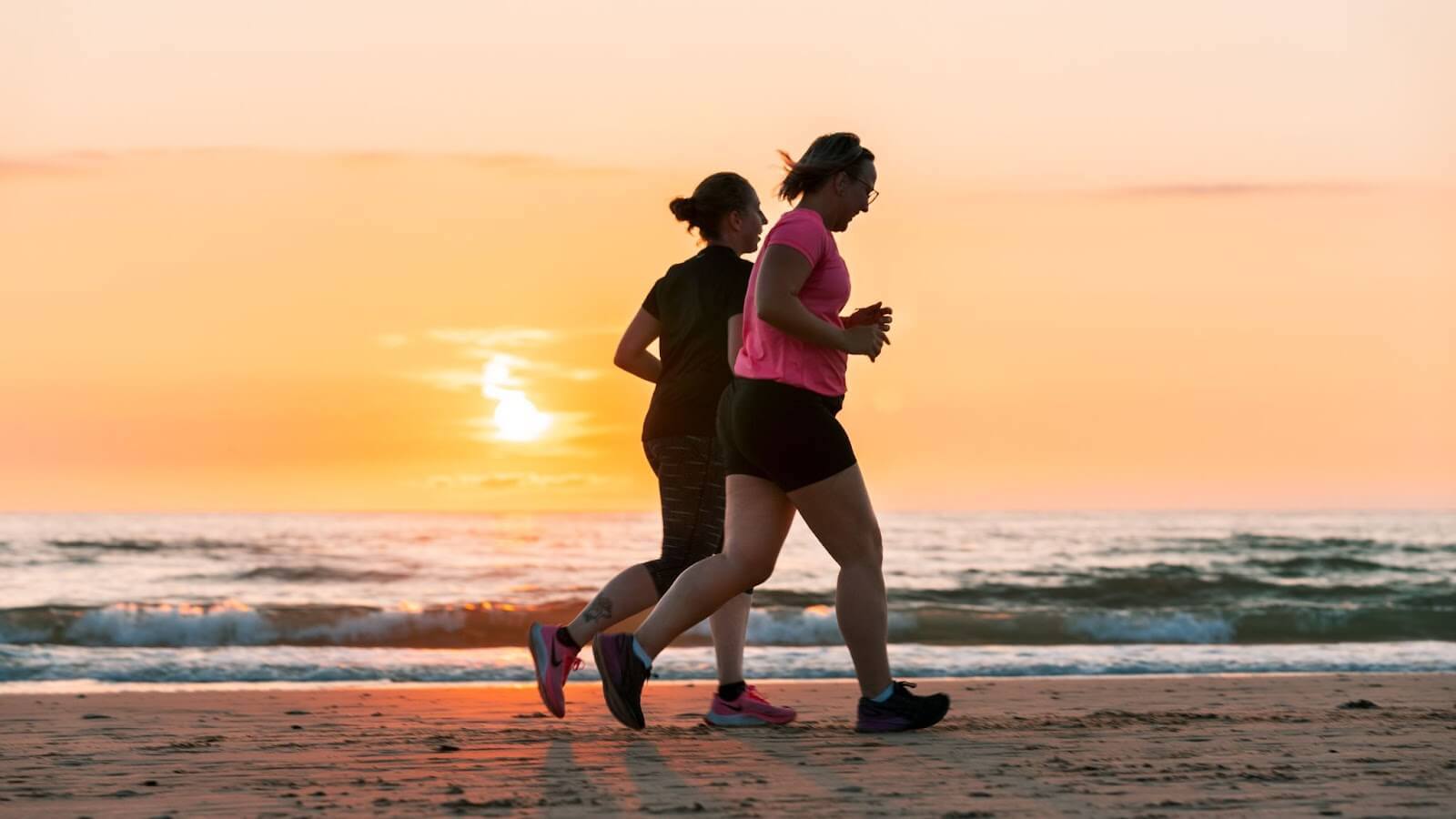 Two runners on the beach